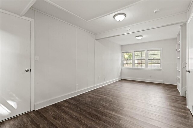331 E 100th Ter, Kansas City, MO 64114 - empty room featuring dark wood-style flooring and a smoke detector