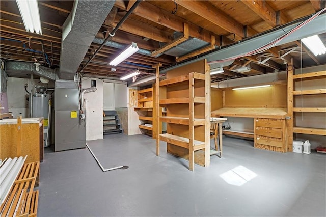 331 E 100th Ter, Kansas City, MO 64114 - unfinished basement featuring water heater, heating unit, stairs, and a workshop area