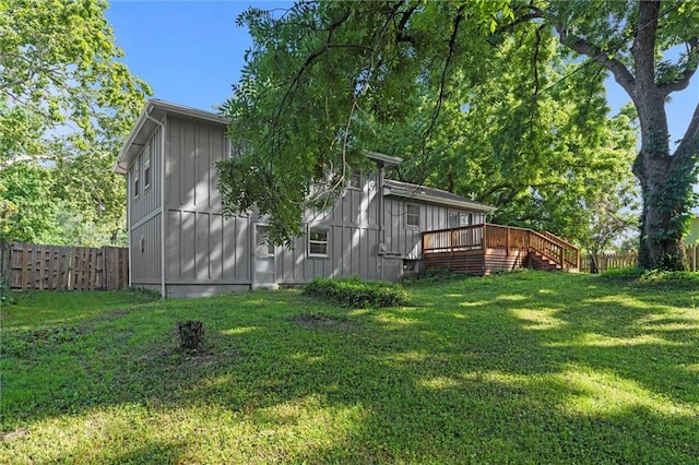 331 E 100th Ter, Kansas City, MO 64114 - fenced backyard with a wooden deck and stairway