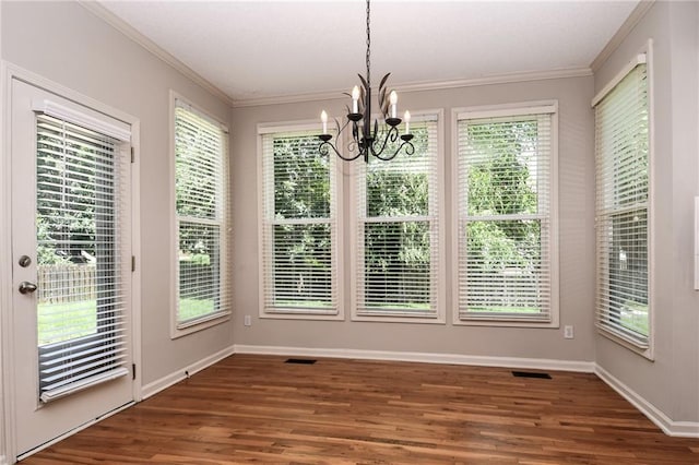 11912 W 132nd St, Overland Park, KS 66213 - unfurnished dining area featuring a chandelier, wood finished floors, and ornamental molding