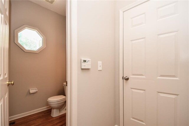 11912 W 132nd St, Overland Park, KS 66213 - bathroom featuring toilet and wood finished floors