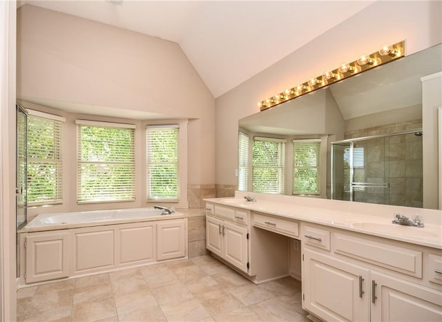 11912 W 132nd St, Overland Park, KS 66213 - full bathroom featuring lofted ceiling, a shower stall, a garden tub, and double vanity