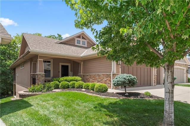 4890 NW Linder Ln, Riverside, MO 64150 - craftsman-style house featuring roof with shingles, a front lawn, stone siding, concrete driveway, and an attached garage