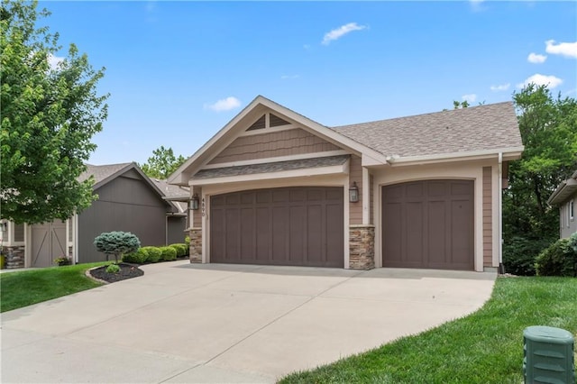 4890 NW Linder Ln, Riverside, MO 64150 - view of front of house with a garage, concrete driveway, a shingled roof, and stone siding