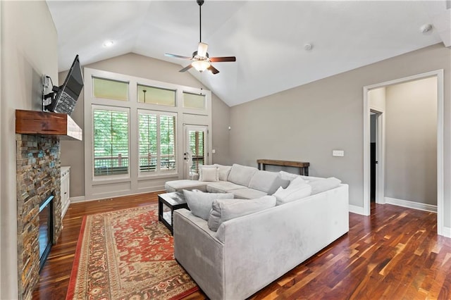 4890 NW Linder Ln, Riverside, MO 64150 - living area with a fireplace, a ceiling fan, vaulted ceiling, and dark wood finished floors