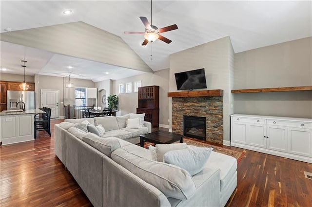 4890 NW Linder Ln, Riverside, MO 64150 - living area featuring ceiling fan, dark wood-style floors, a fireplace, and lofted ceiling