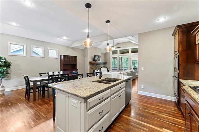 4890 NW Linder Ln, Riverside, MO 64150 - kitchen featuring stainless steel appliances, dark wood-style floors, open floor plan, a ceiling fan, and lofted ceiling