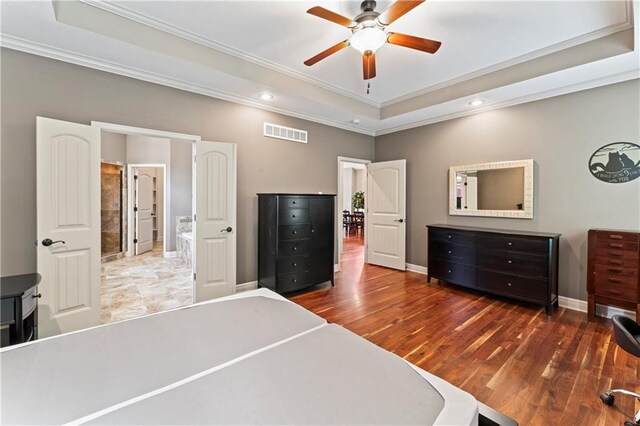 4890 NW Linder Ln, Riverside, MO 64150 - bedroom featuring a raised ceiling, ornamental molding, recessed lighting, wood finished floors, and a ceiling fan