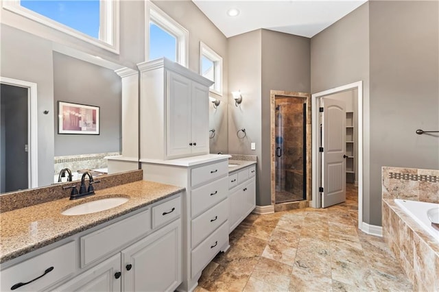 4890 NW Linder Ln, Riverside, MO 64150 - bathroom with a shower stall, vanity, and a bath