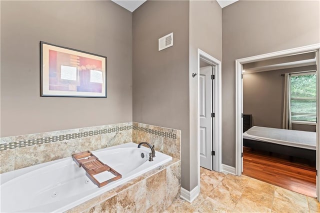 4890 NW Linder Ln, Riverside, MO 64150 - full bath featuring a whirlpool tub and baseboards