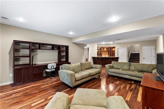 4890 NW Linder Ln, Riverside, MO 64150 - living area featuring bar area, wood-type flooring, an office area, stairs, and recessed lighting