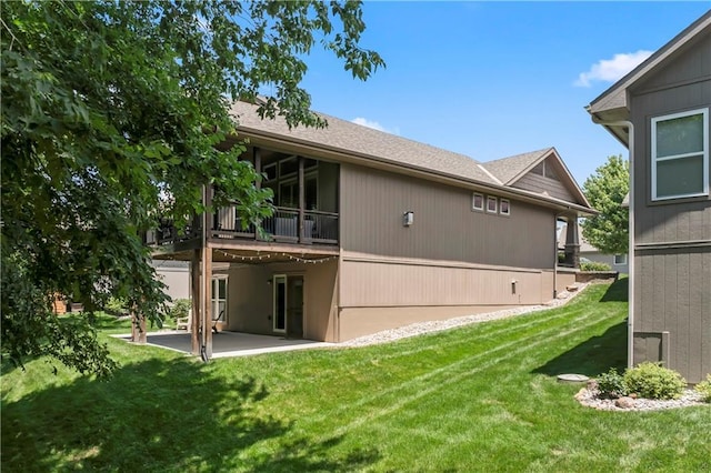 4890 NW Linder Ln, Riverside, MO 64150 - rear view of house with a patio area, a lawn, and a wooden deck