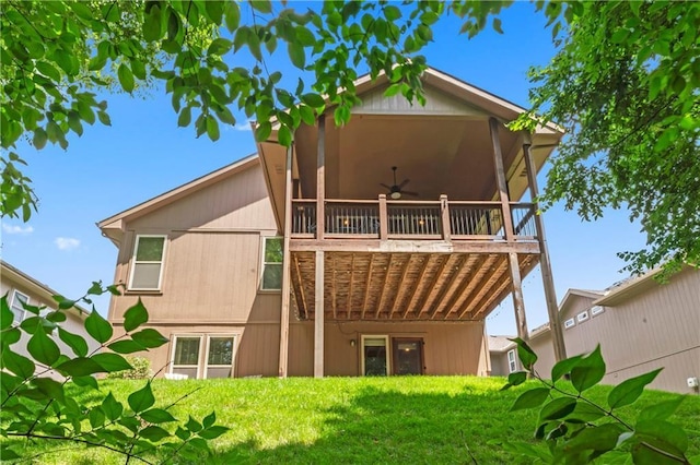 4890 NW Linder Ln, Riverside, MO 64150 - back of house featuring ceiling fan, a lawn, and a wooden deck