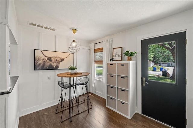 236 W Park St, Gardner, KS 66030 - dining area featuring dark wood finished floors, plenty of natural light, and a decorative wall