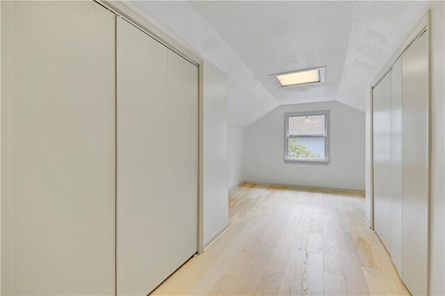 16117 W 125th Ter, Olathe, KS 66062 - additional living space featuring light wood-style floors and vaulted ceiling