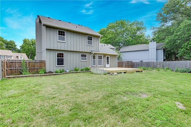 16117 W 125th Ter, Olathe, KS 66062 - rear view of house with board and batten siding, a fenced backyard, and a wooden deck