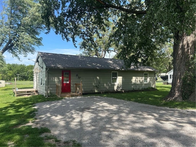 10 Platte St, Dearborn, MO 64439 - rear view of property with a lawn