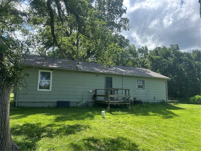 10 Platte St, Dearborn, MO 64439 - back of house featuring a lawn and a wooden deck