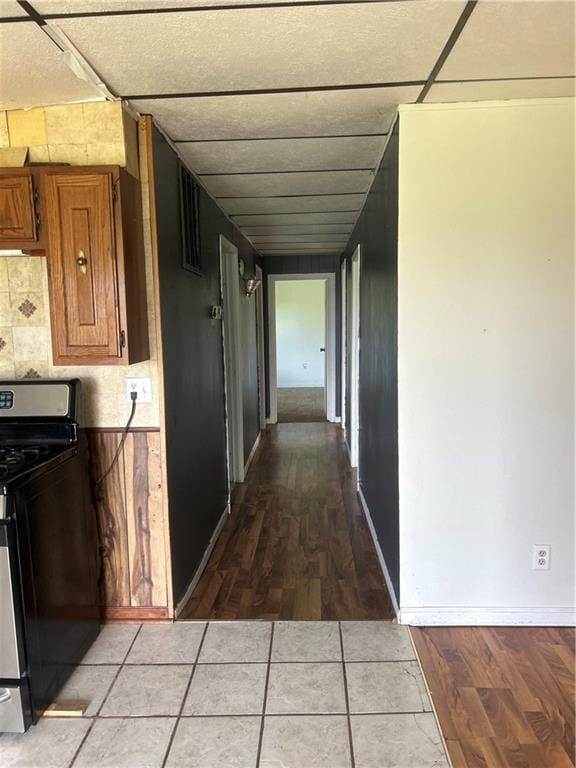 10 Platte St, Dearborn, MO 64439 - hallway with light wood-style flooring and a drop ceiling