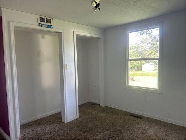 10 Platte St, Dearborn, MO 64439 - unfurnished bedroom with carpet, a textured ceiling, and a closet