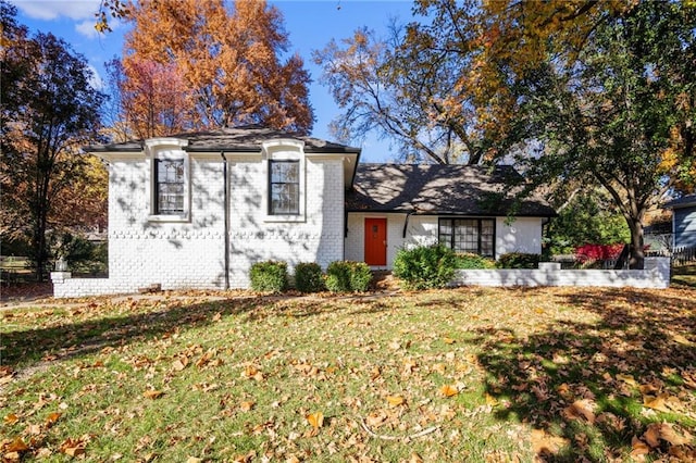 3322 W 95th St, Leawood, KS 66206 - view of front of house featuring brick siding and a front lawn