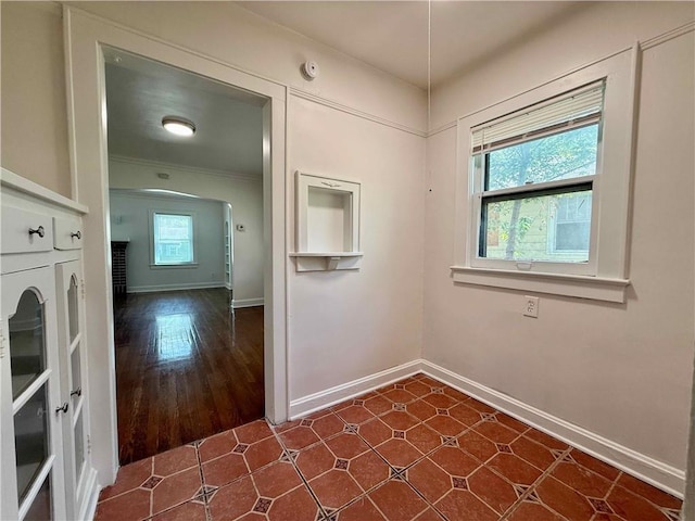 2416 E 70th St, Kansas City, MO 64132 - unfurnished dining area featuring baseboards