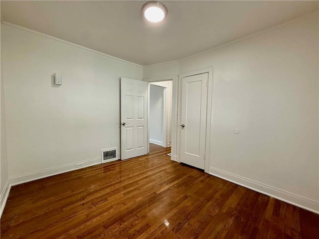 2416 E 70th St, Kansas City, MO 64132 - empty room with crown molding and wood finished floors