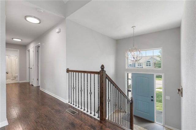 2712 E Sycamore St, Tonganoxie, KS 66086 - entrance foyer with wood finished floors and a chandelier