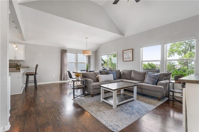 2712 E Sycamore St, Tonganoxie, KS 66086 - living room featuring lofted ceiling, dark wood-style floors, and a ceiling fan
