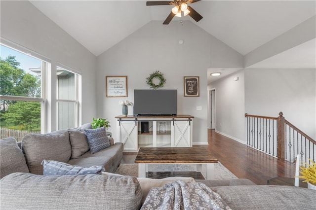 2712 E Sycamore St, Tonganoxie, KS 66086 - living area featuring wood finished floors, a ceiling fan, and high vaulted ceiling