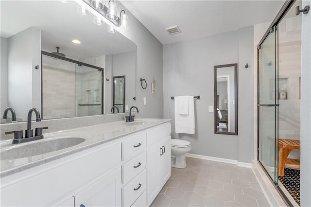 2712 E Sycamore St, Tonganoxie, KS 66086 - bathroom featuring a stall shower, double vanity, and tile patterned floors