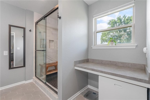 2712 E Sycamore St, Tonganoxie, KS 66086 - bathroom featuring a shower stall and tile patterned floors