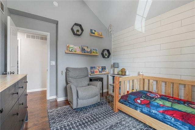2712 E Sycamore St, Tonganoxie, KS 66086 - bedroom with vaulted ceiling and dark wood-type flooring