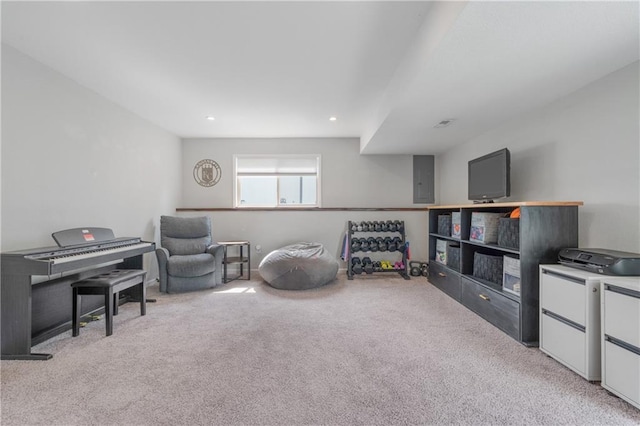 2712 E Sycamore St, Tonganoxie, KS 66086 - sitting room with light colored carpet, electric panel, and recessed lighting
