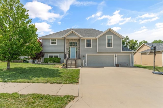 2712 E Sycamore St, Tonganoxie, KS 66086 - raised ranch with a garage, concrete driveway, and a front lawn