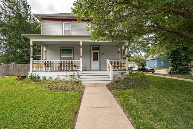 703 S Princeton St, Ottawa, KS 66067 - american foursquare style home with a porch