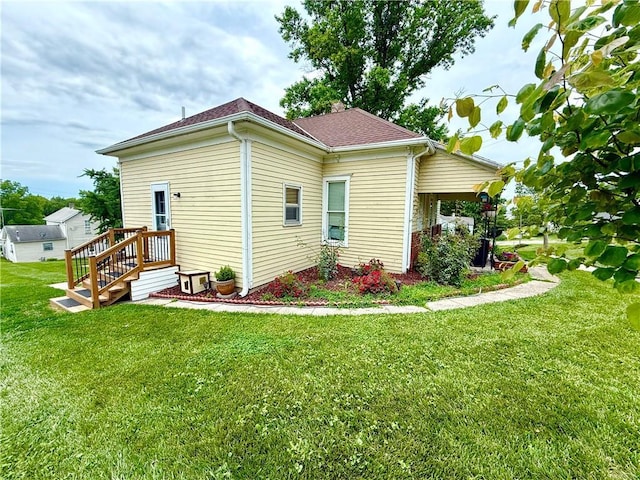 226 Mckenzie St, Barnard, MO 64423 - view of property exterior with a lawn and a shingled roof