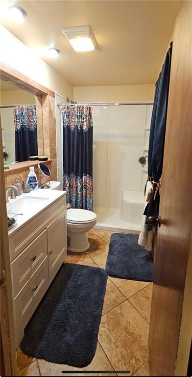 226 Mckenzie St, Barnard, MO 64423 - full bath featuring tile patterned floors, vanity, and a shower with curtain
