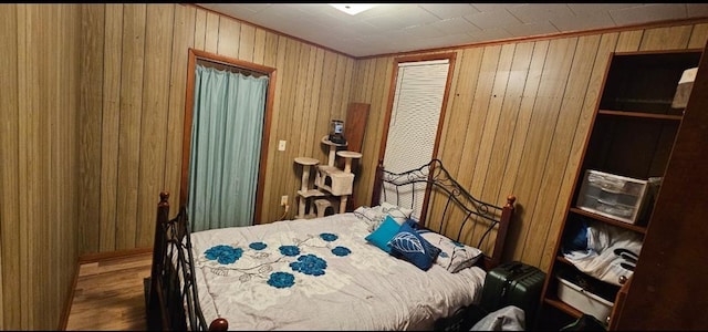 226 Mckenzie St, Barnard, MO 64423 - bedroom with wooden walls and wood finished floors