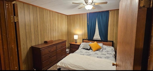 226 Mckenzie St, Barnard, MO 64423 - bedroom with wood walls, ceiling fan, and crown molding
