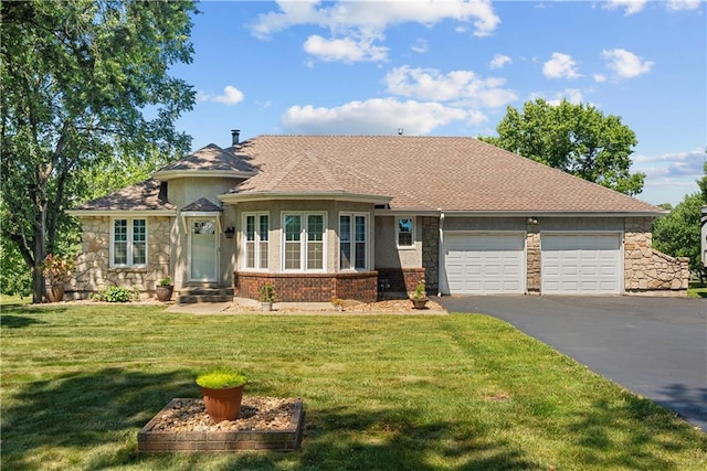 3602 S Sweeney Rd, Grain Valley, MO 64029 - view of front of property with asphalt driveway, a garage, a front yard, and stone siding