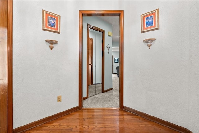 3602 S Sweeney Rd, Grain Valley, MO 64029 - hallway featuring wood finished floors and baseboards