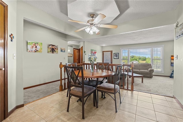 3602 S Sweeney Rd, Grain Valley, MO 64029 - dining room featuring light colored carpet, a textured ceiling, light tile patterned floors, and ceiling fan
