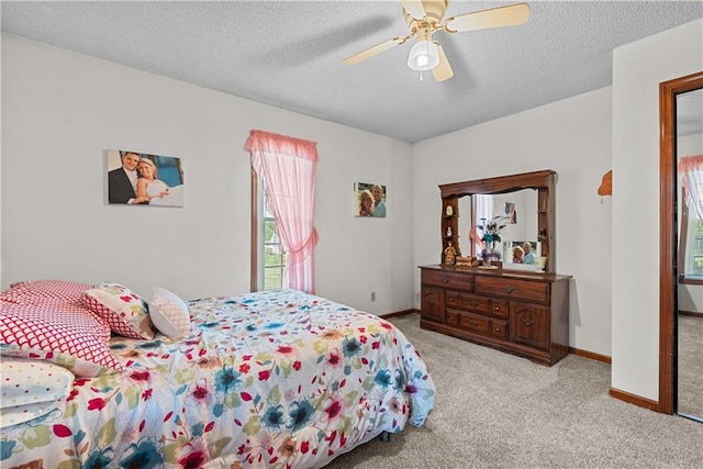 3602 S Sweeney Rd, Grain Valley, MO 64029 - carpeted bedroom with a ceiling fan and a textured ceiling