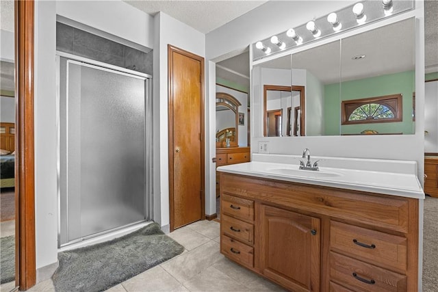 3602 S Sweeney Rd, Grain Valley, MO 64029 - bathroom featuring a stall shower, vanity, and tile patterned floors
