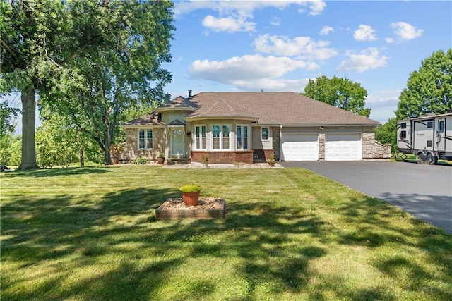 3602 S Sweeney Rd, Grain Valley, MO 64029 - view of front of property featuring driveway, an attached garage, and a front lawn