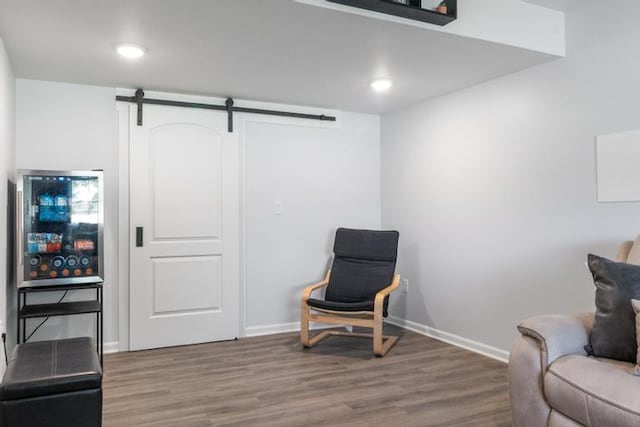 3102 Katy Trail Dr, Harrisonville, MO 64701 - living area with wood finished floors, a barn door, and recessed lighting