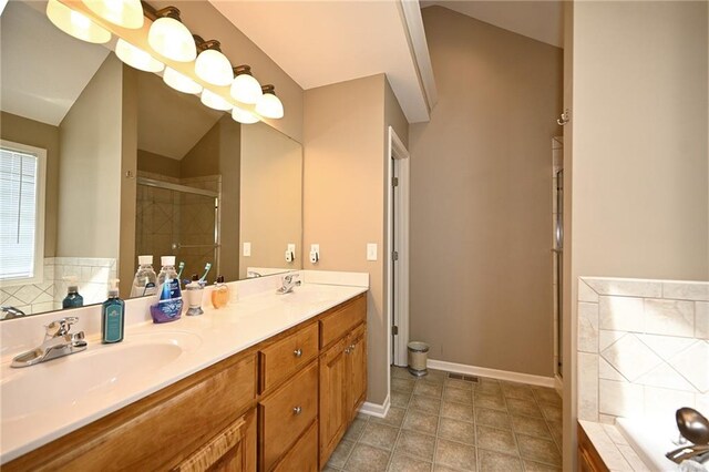 19617 Harbor Dr, Smithville, MO 64089 - full bathroom featuring a shower stall, double vanity, a garden tub, and lofted ceiling