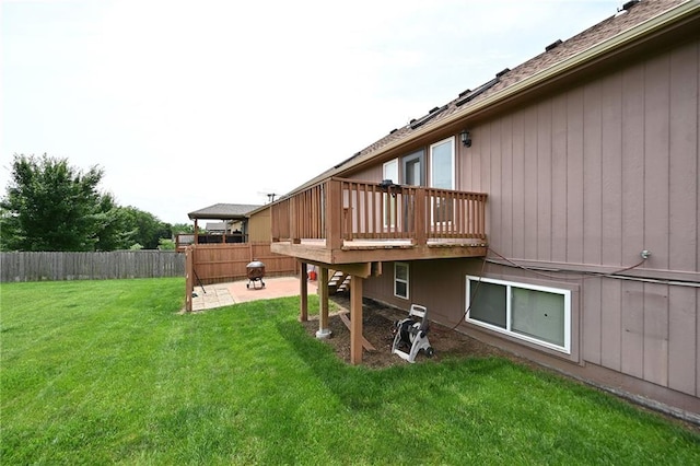 19617 Harbor Dr, Smithville, MO 64089 - rear view of house featuring a fenced backyard, a patio area, a wooden deck, and roof with shingles