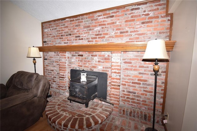 211 Southside Ct, Excelsior Springs, MO 64024 - detailed view of a wood stove and a textured ceiling